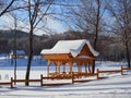 Beautiful winter landscape with a wooden patio covered with a thick layer of snow on a Sunny frosty day Royalty Free Stock Photo