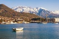Beautiful winter Mediterranean landscape. Montenegro, Bay of Kotor. View of snow-capped mountain of Lovcen and town of Tivat Royalty Free Stock Photo