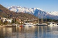 Beautiful winter Mediterranean landscape. Montenegro, Bay of Kotor. View of snow-capped peaks of Lovcen mountain and Tivat city Royalty Free Stock Photo