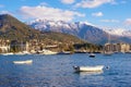 Beautiful winter Mediterranean landscape. Montenegro. View of Bay of  Kotor near Tivat city and snow-capped Lovcen mountains Royalty Free Stock Photo