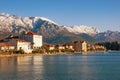 Beautiful winter Mediterranean landscape. Montenegro, Kotor Bay. View of embankment of Tivat city and snowy mountains of Lovcen