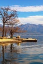 Beautiful winter Mediterranean landscape. Montenegro, Herceg Novi. View of Kotor Bay and snow-capped Lovcen mountain Royalty Free Stock Photo