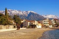 Winter Mediterranean landscape. Montenegro. View of Tivat town and snow-capped Lovcen mountain Royalty Free Stock Photo