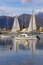 Beautiful winter Mediterranean landscape. Sailboats and fishing boats on water. Montenegro, Kotor Bay Royalty Free Stock Photo