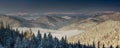 Beautiful winter panoramic landscape of mountains with snow covered trees. Gorgany is a mountain range in Eastern Carpathians.