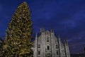Beautiful winter panoramic view to the Duomo of Milan and Christmas tree in early morning hours. Royalty Free Stock Photo