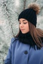 Beautiful winter portrait of young woman in the winter snowy scenery Royalty Free Stock Photo