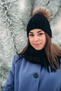 Beautiful winter portrait of young woman in the winter snowy scenery Royalty Free Stock Photo