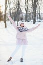 Beautiful winter portrait of young woman in the winter snowy scenery Royalty Free Stock Photo