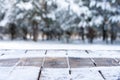 Beautiful winter scene. blurred background of snowy christmas nature background, Wood table top on shiny bokeh. For product Royalty Free Stock Photo