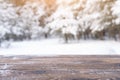 Beautiful winter scene. blurred background of snowy christmas nature background, Wood table top on shiny bokeh. For Royalty Free Stock Photo