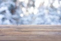 Beautiful winter scene. blurred background of snowy christmas nature background, Wood table top on shiny bokeh. For product Royalty Free Stock Photo