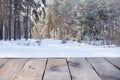 Beautiful winter scene. blurred background of snowy christmas nature background, Wood table top on shiny bokeh. For product Royalty Free Stock Photo