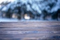 Beautiful winter scene. blurred background of snowy christmas nature background, Wood table top on shiny bokeh. For product Royalty Free Stock Photo