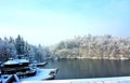Beautiful winter scenery of the Bear Lake in the Sovata resort, Romania with trees covered by snow