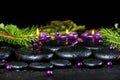 Beautiful winter spa concept of zen basalt stones with drops, li