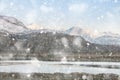 Beautiful Winter sunrise landscape image of Mount Snowdon and other peaks in Snowdonia National Park in heavy snow storm