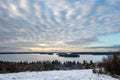 Beautiful winter sunset landscape view of water, islands, sky and horizon in the Stockholm archipelago. Royalty Free Stock Photo