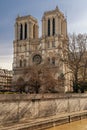 Beautiful winter view of the Notre Dame Cathedral and the River Seine in Paris, France Royalty Free Stock Photo
