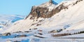 Beautiful winter view on the Reyniskirkja Church near Reynisfjara beach in South Iceland. Snowy mountains and meadows