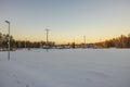 Beautiful winter view of stadium with ski tracks and building of sports club.