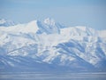 Beautiful winter volcanic landscape of Kamchatka Peninsula: view of eruption active Klyuchevskoy Volcano at sunrise. Eurasia,