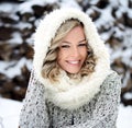 A beautiful winter woman with white teeth and a perfect smile. Happy sincere outdoor portrait of a attractive model Royalty Free Stock Photo