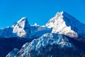 Beautiful winter wonderland mountain scenery in the Alps with pilgrimage church of Maria Gern and famous Watzmann summit in the Royalty Free Stock Photo