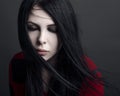 Beautiful witch and Halloween theme: portrait of a girl vampire with black hair Royalty Free Stock Photo