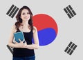 Beautiful woman against the Republic of Korea flag background. Travel, study and work in South Korea