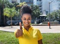 Beautiful woman with amazing hairstyle showing thumb up Royalty Free Stock Photo