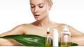 Beautiful woman applies organic cosmetic and oils for beauty. Spa and wellness. Clean skin, shiny hair. Healthcare