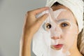 Beautiful women applying facial mask with moisturizer Royalty Free Stock Photo