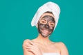 Beautiful woman applying facial mask. Mud facial mask, face clay mask spa. Beautiful woman with cosmetic mud facial Royalty Free Stock Photo