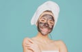 Beautiful woman applying facial mask. Mud facial mask, face clay mask spa. Beautiful woman with cosmetic mud facial Royalty Free Stock Photo