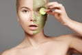 Beautiful Woman Applying Green Facial Mask. Beauty Treatments. Close-up Portrait of Spa Girl Apply Clay Facial mask Royalty Free Stock Photo