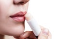 Beautiful woman applying hygienic lip balm. Royalty Free Stock Photo