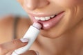 Beautiful Woman Applying Lip Protector On Lips Skin. Beauty Royalty Free Stock Photo