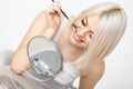 Beautiful Woman applying Mascara on Eyelashes. Eye Makeup Royalty Free Stock Photo
