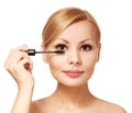Beautiful woman applying mascara on her eyelashes, isolated Royalty Free Stock Photo