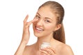 Beautiful woman applying moisturizer cream Royalty Free Stock Photo