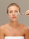 Beautiful woman applying mud mask with brush Royalty Free Stock Photo