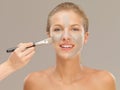 Beautiful woman applying mud mask with brush Royalty Free Stock Photo