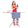 Beautiful woman in apron stack towels clean ironing board iron Royalty Free Stock Photo