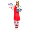 Beautiful woman in apron stack towels ironed clean clothes in hand Royalty Free Stock Photo