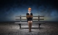 Beautiful woman architect sitting on wooden bench Royalty Free Stock Photo