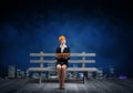 Beautiful woman architect sitting on wooden bench Royalty Free Stock Photo