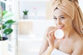 A beautiful woman asia using a skin care product, moisturizer Royalty Free Stock Photo