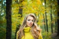 Beautiful Woman with Autumn Leaves on Fall Nature Background. Outdoor portrait Gorgeous brunette model girl with sunny Royalty Free Stock Photo