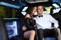 Beautiful woman in back prom dress and handsome guy in suit, teenager ready for a luxury night.